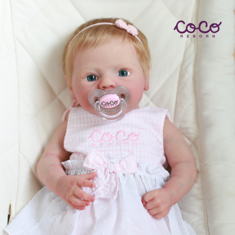 Lena, a little girl, with honey-blonde hair, light blue eyes, and fair skin.