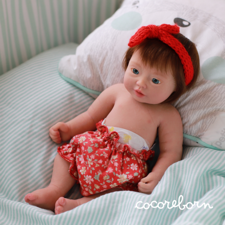 Moly, a little girl, with chocolate hair, blue eyes, and fair skin.