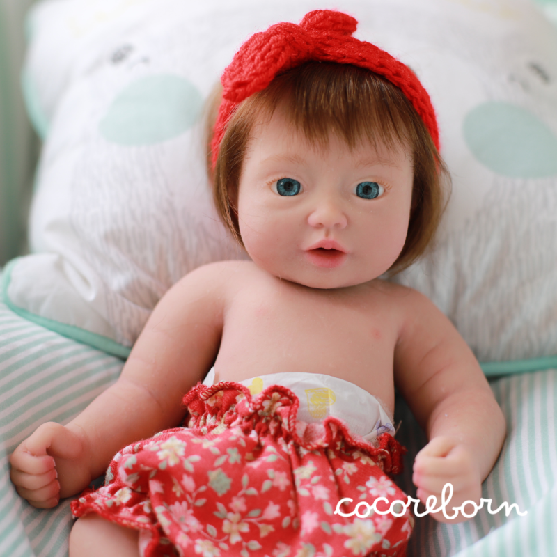 Moly, a little girl, with chocolate hair, blue eyes, and fair skin.