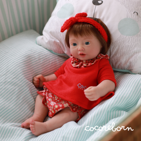 Moly, a little girl, with chocolate hair, blue eyes, and fair skin.