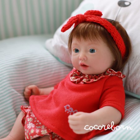 Moly, a little girl, with chocolate hair, blue eyes, and fair skin.