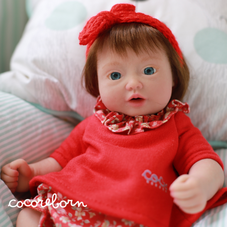 Moly, a little girl, with chocolate hair, blue eyes, and fair skin.