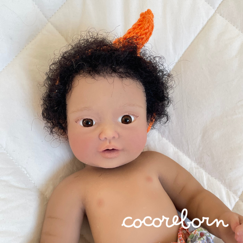 Moly, a girl with black afro hair, brown eyes, and dark skin.
