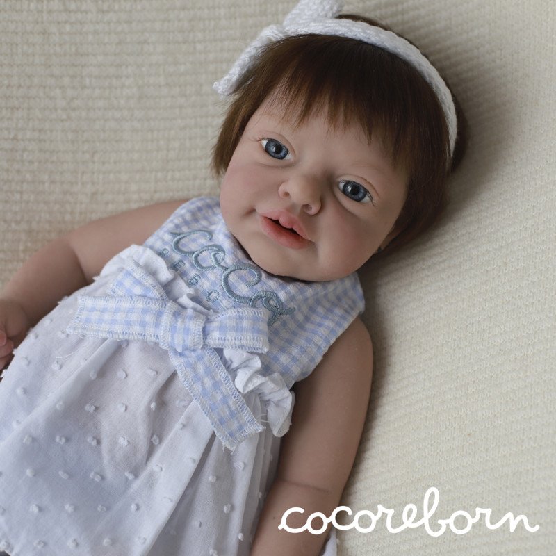Luna, a girl with chocolate hair, blue eyes, and fair skin.