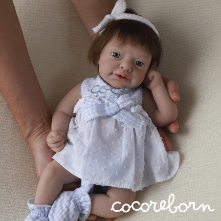 Luna, a girl with chocolate hair, blue eyes, and fair skin.