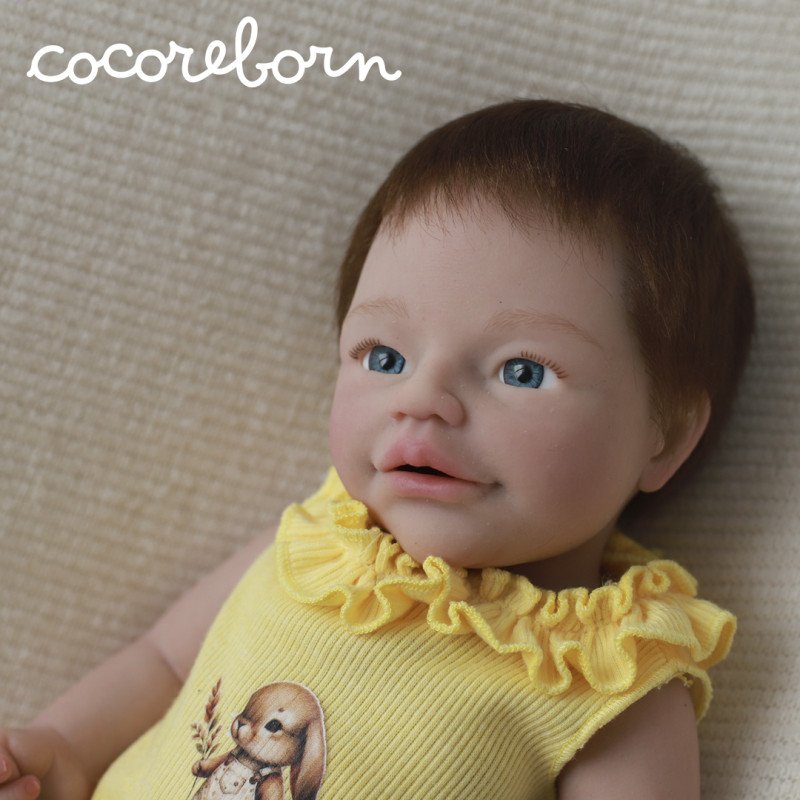 Anuk, a child with chocolate-brown hair, light blue eyes, and fair skin.