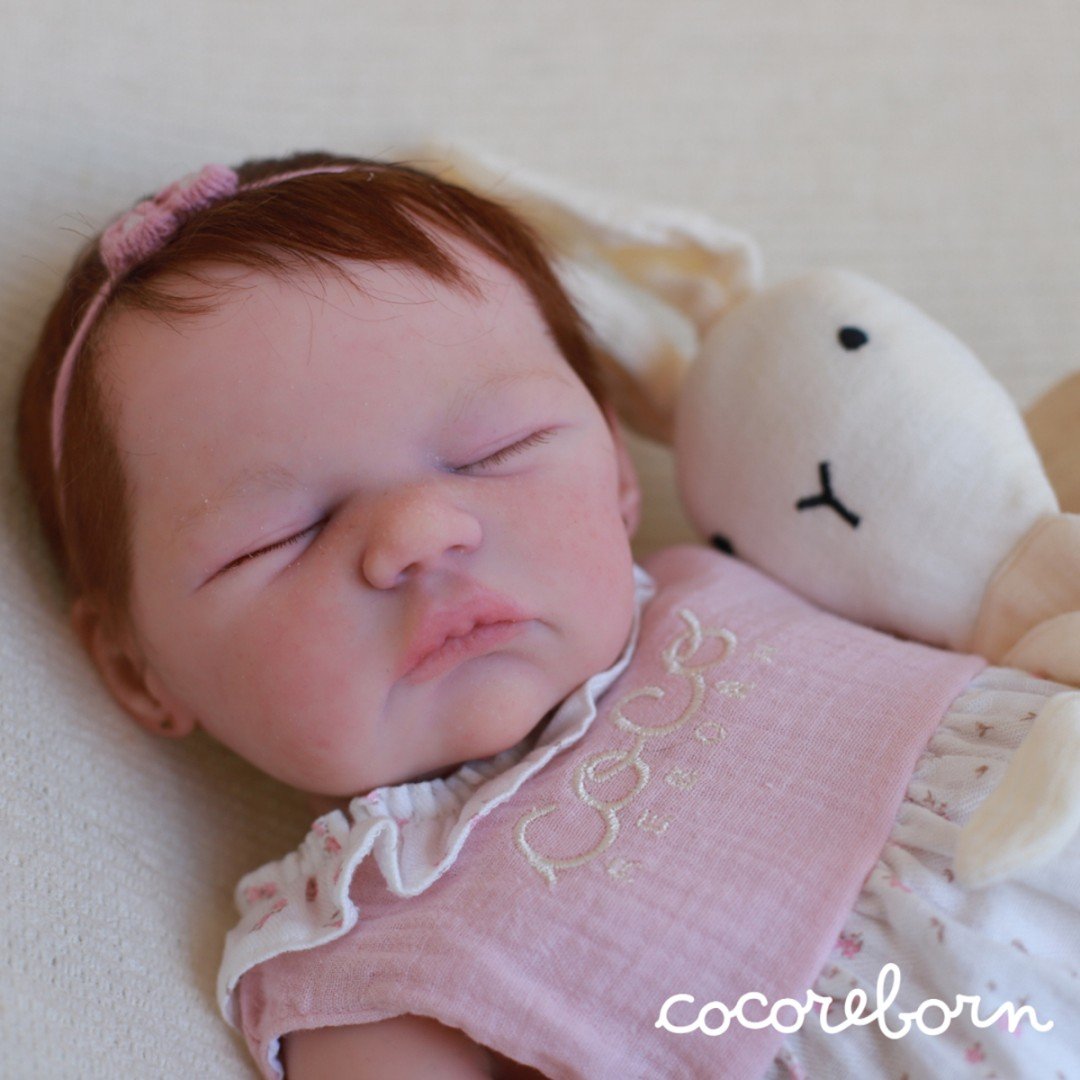 Kaillie, a girl with brown hair and closed eyes
