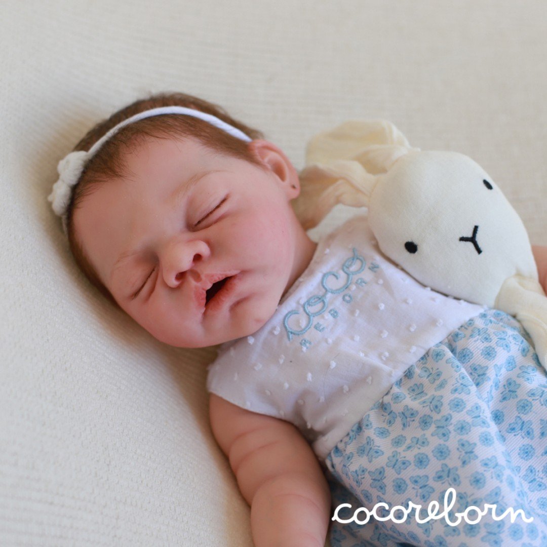 Marlowe, a boy with brown hair and closed eyes