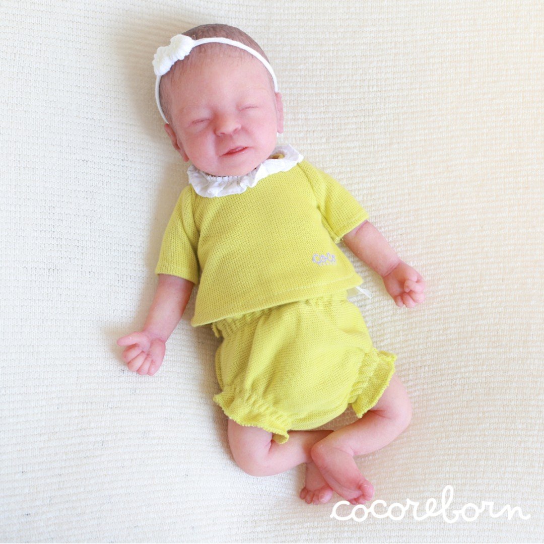Sonya, a girl with brown hair and closed eyes